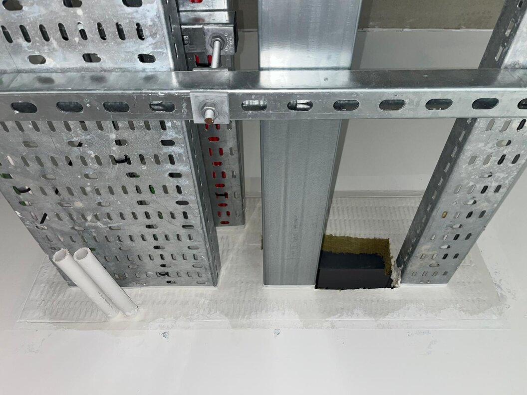 Fire stopping applied around service penetrations